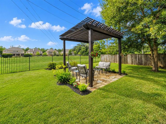 79 W Wading Pond Circle, The Woodlands, TX 77375
