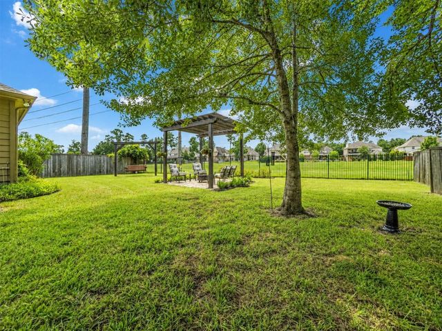 79 W Wading Pond Circle, The Woodlands, TX 77375