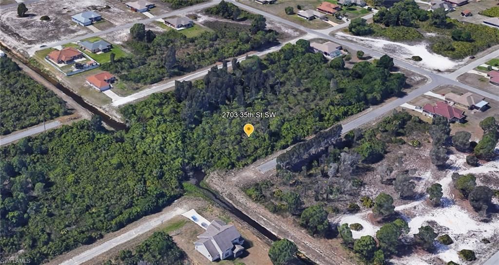 2703 35th ST SW, LEHIGH ACRES, FL 33976 — exterior