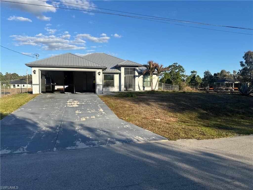 717 Fleming AVE S, LEHIGH ACRES, FL 33974 — photo 2