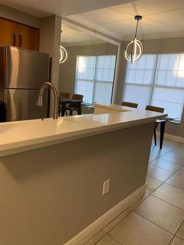 6020 W SAMPLE Road 105, Coral Springs, FL 33067