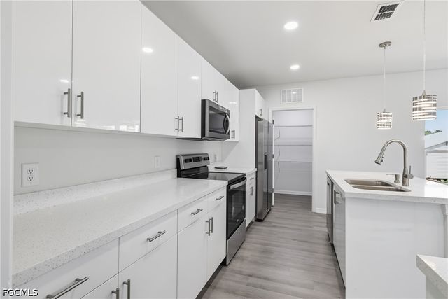 1406 Ford CIR, Lehigh Acres, FL 33936