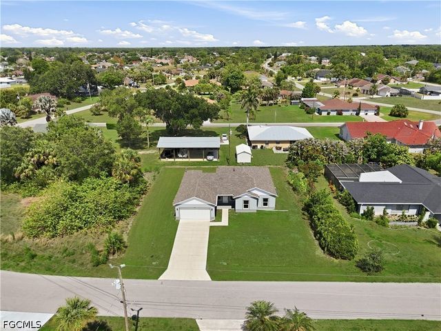 1406 Ford CIR, Lehigh Acres, FL 33936
