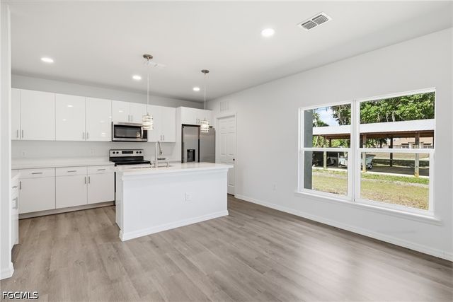 1406 Ford CIR, Lehigh Acres, FL 33936