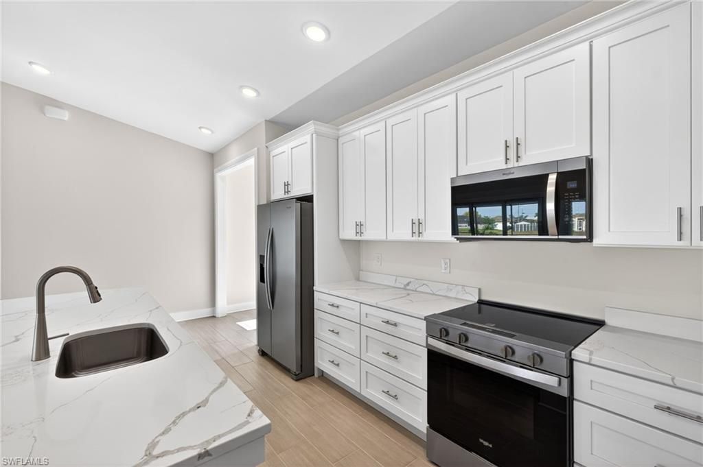 Image 6 of property listing at 2628 SW 10th AVE, Cape Coral, FL 33914