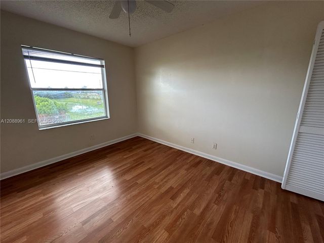 910 E Cypress Way E, Palm Springs, FL 33406