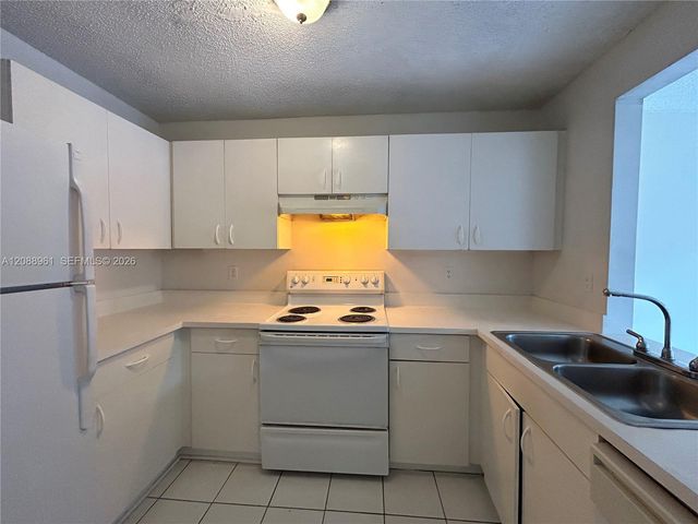 910 E Cypress Way E, Palm Springs, FL 33406