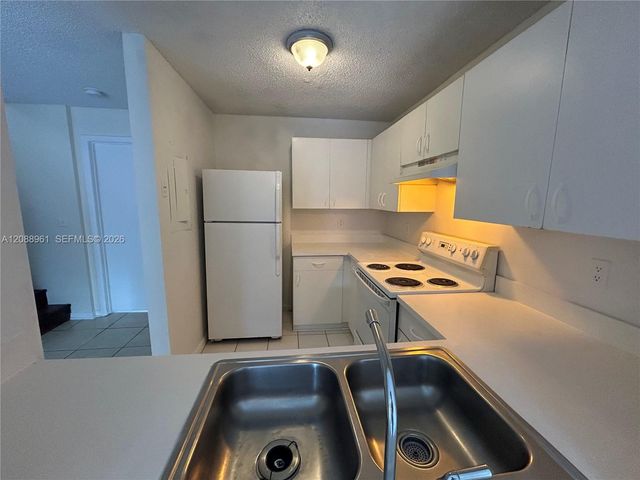 910 E Cypress Way E, Palm Springs, FL 33406