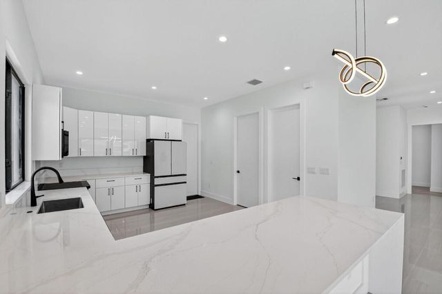 3920 Espan Court, Palm Springs, FL 33461