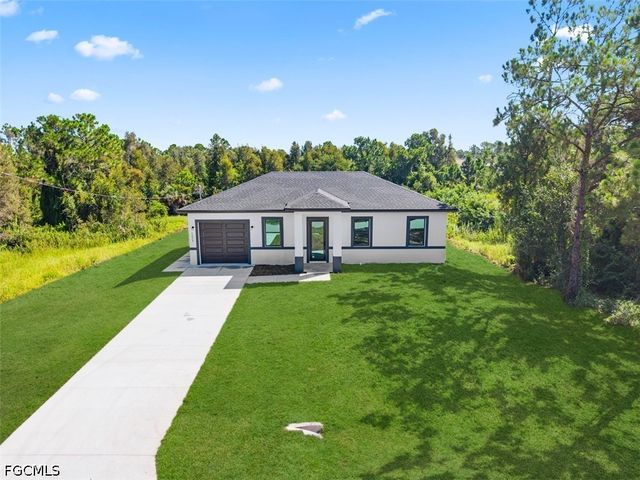 1553 Meadow RD, Lehigh Acres, FL 33976