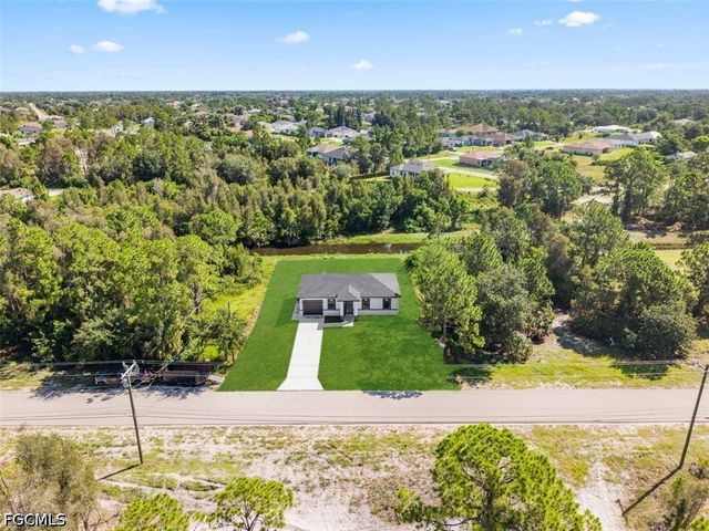 1553 Meadow RD, Lehigh Acres, FL 33976