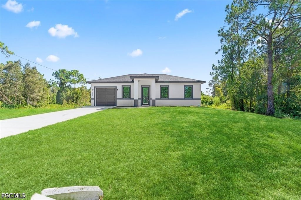 1553 Meadow RD, Lehigh Acres, FL 33976