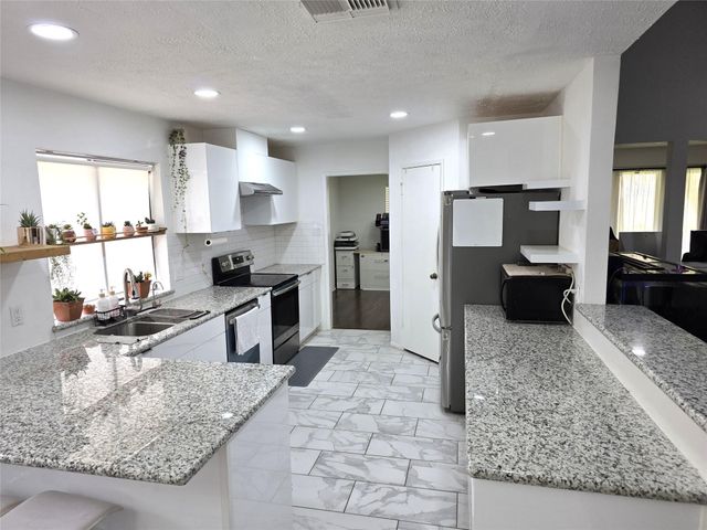 8827 Woodleigh Drive, Houston, TX 77083