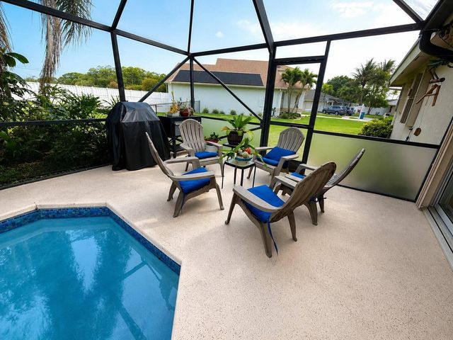 111 Camelot Court, Royal Palm Beach, FL 33411