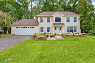 25 Winding Woods Way, Manalapan, NJ 07726