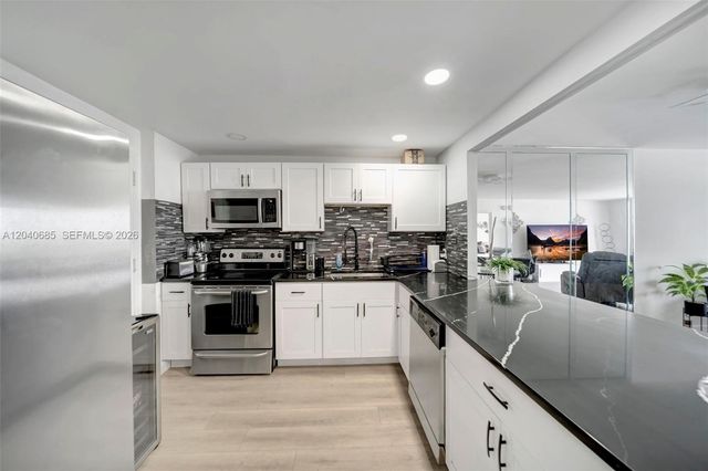 427 Golden Isles Drive 16H, Hallandale Beach, FL 33009