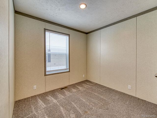 284 Dakota Court, Sumpter Township, MI 48111