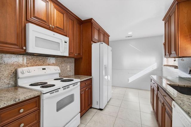 6100 Olivewood Circle, Greenacres, FL 33463