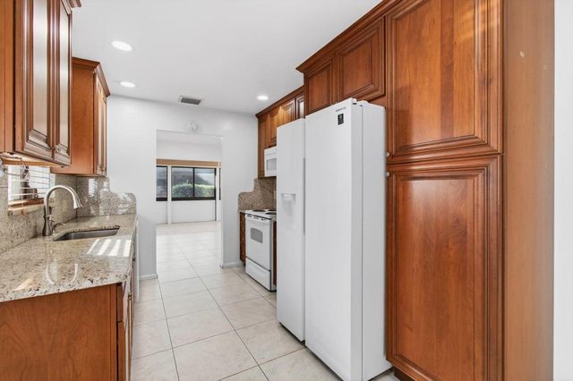 6100 Olivewood Circle, Greenacres, FL 33463