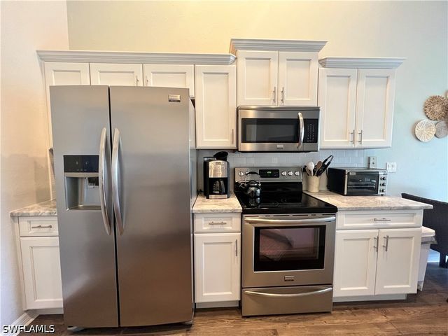 25240 PELICAN CREEK CIR 202, Bonita Springs, FL 34134