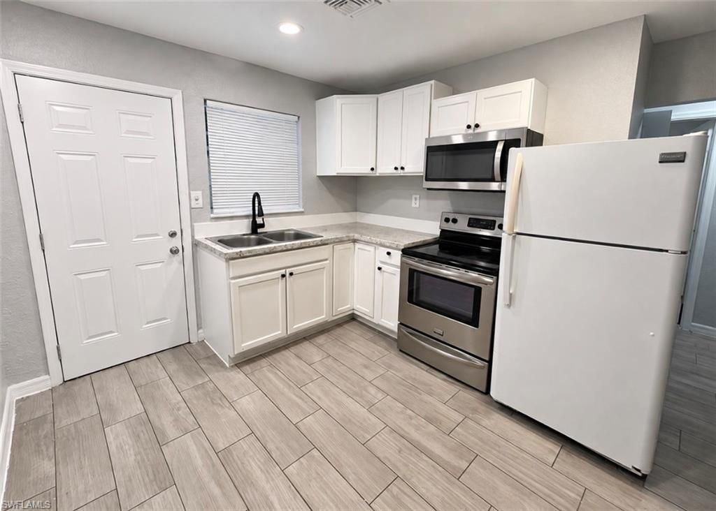 1140 4th WAY, NORTH FORT MYERS, FL 33903 — photo 4
