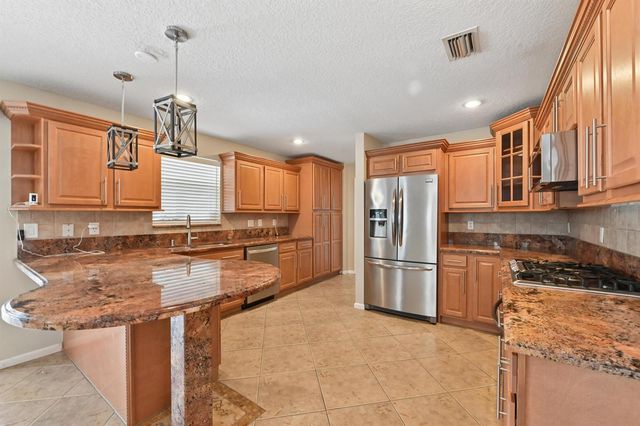 1163 Peninsula Way, Greenacres, FL 33413