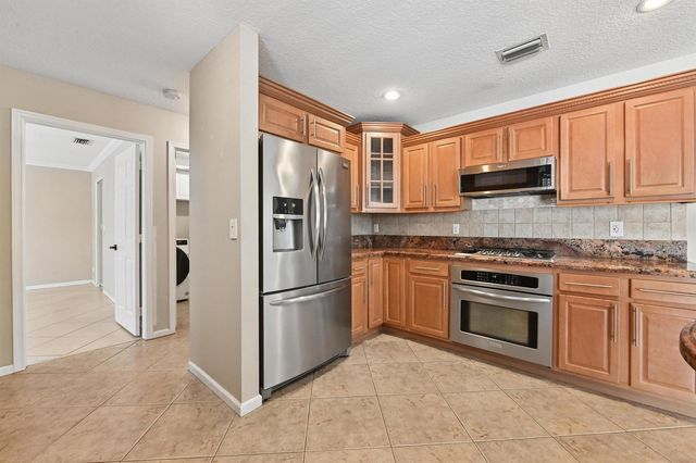 1163 Peninsula Way, Greenacres, FL 33413