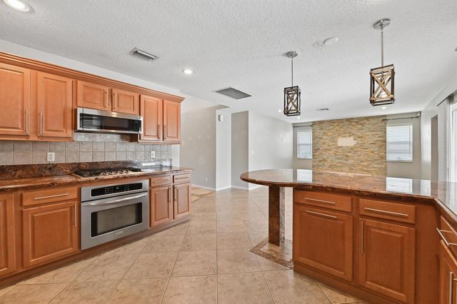 1163 Peninsula Way, Greenacres, FL 33413