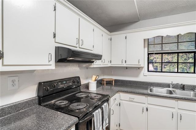 1141 Holly Hills SW Drive, Lilburn, GA 30047