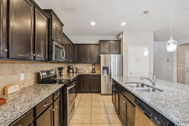 8875 QIN LOOP, Kissimmee, FL 34747