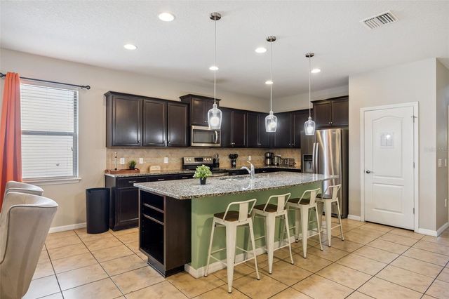 8875 QIN LOOP, Kissimmee, FL 34747