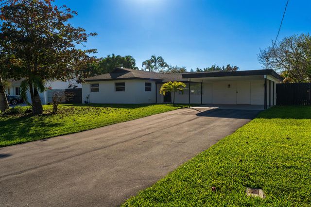 1891 Meadow Court, Palm Springs, FL 33406