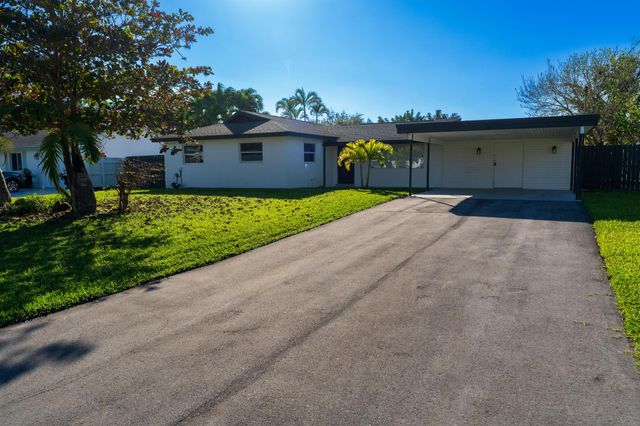 1891 Meadow Court, Palm Springs, FL 33406
