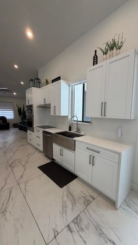 132 NOTTINGHAM Road, Royal Palm Beach, FL 33411