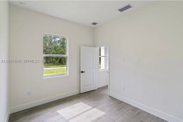 710 Peacock Ave, Lehigh Acres, FL 33974