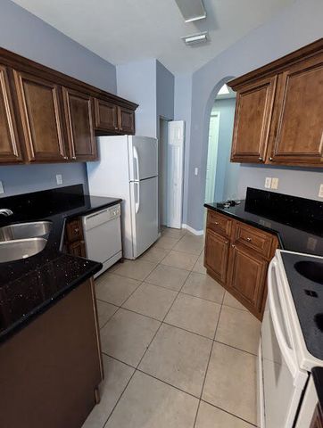 999 Pipers Cay Drive, West Palm Beach, FL 33415