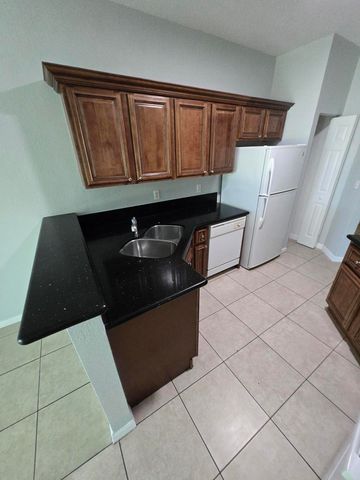 999 Pipers Cay Drive, West Palm Beach, FL 33415