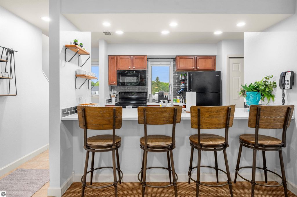 Image 15 of property listing at 5558 Golfview Court, Williamsburg, MI 49690