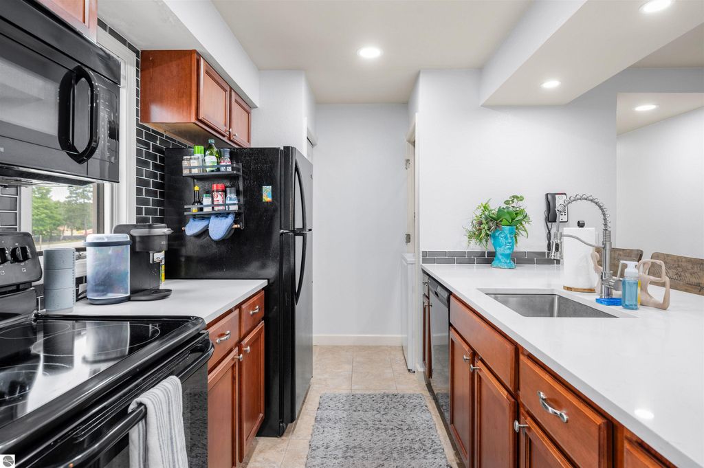 Image 16 of property listing at 5558 Golfview Court, Williamsburg, MI 49690