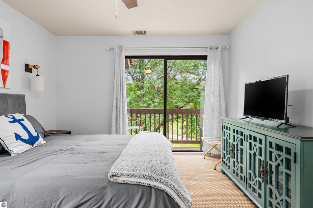 Image 25 of property listing at 5558 Golfview Court, Williamsburg, MI 49690