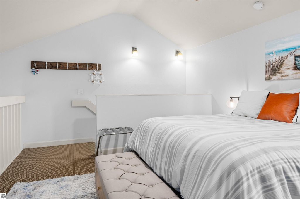 Image 32 of property listing at 5558 Golfview Court, Williamsburg, MI 49690