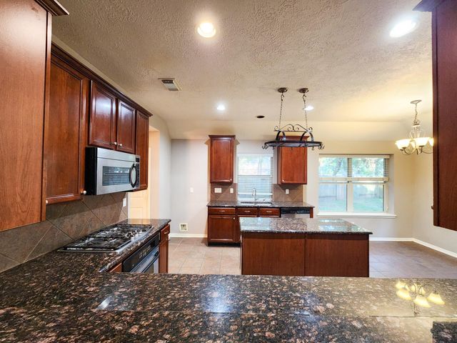 7 Wild Orchid Court, Conroe, TX 77385