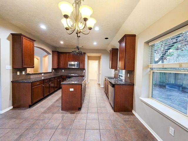 7 Wild Orchid Court, Conroe, TX 77385