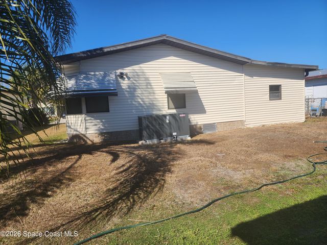 1334 Barefoot Circle N, Barefoot Bay, FL 32976