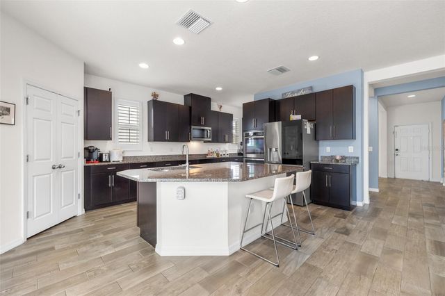 1565 FEATHER GRASS LOOP, Lutz, FL 33558