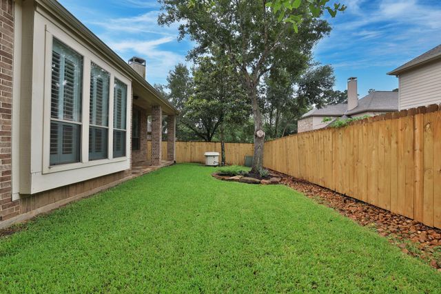 7 Woodmoor Place, Magnolia, TX 77354