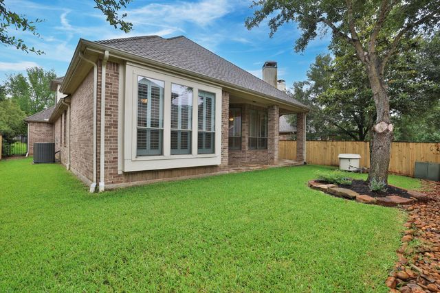 7 Woodmoor Place, Magnolia, TX 77354
