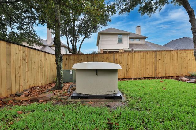 7 Woodmoor Place, Magnolia, TX 77354
