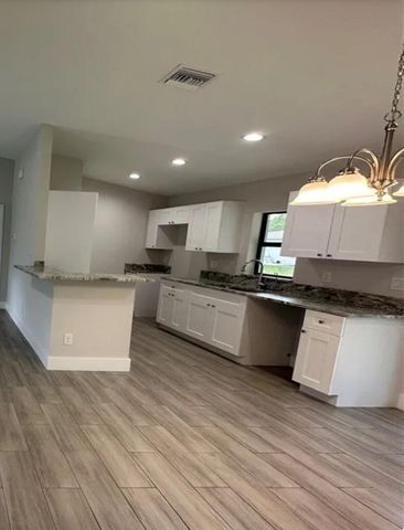 1046 Cheney Avenue S, Lehigh Acres, FL 33974