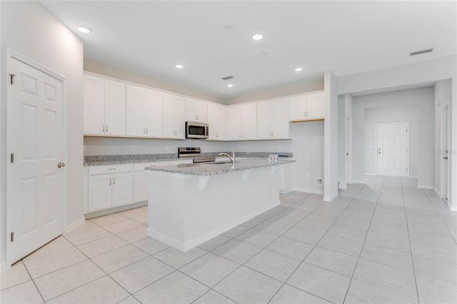 12977 TROVITA DRIVE, Grand Island, FL 32735